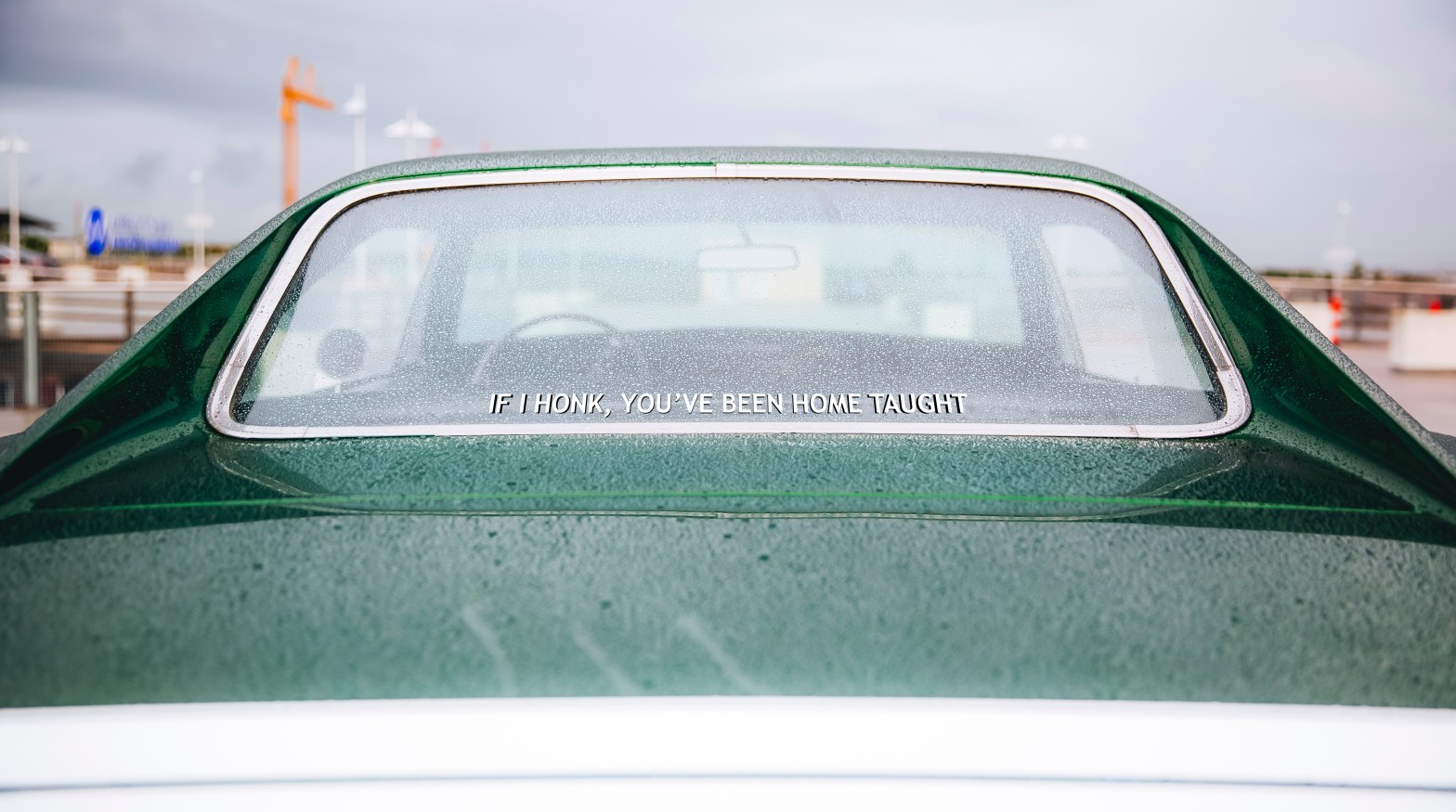 Car with bumper sticker that states, "If I honk, you've been home taught"