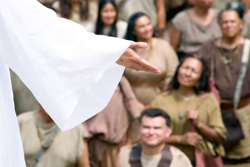 Jesus Christ's scarred hand outstretched